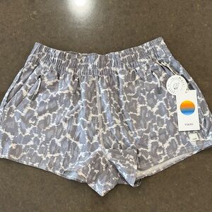 NWT Vuori Dash short in gray and white. Size medium.